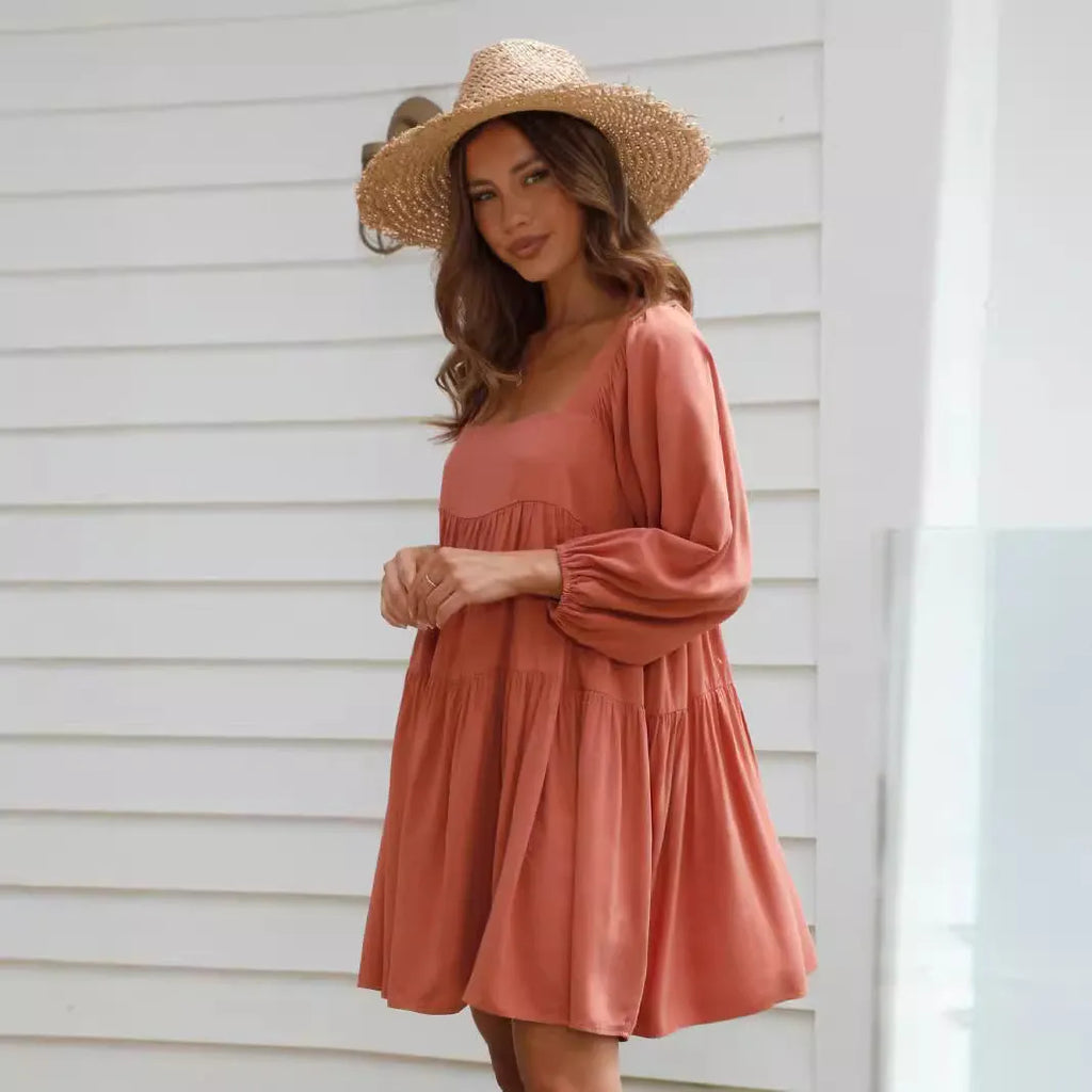 Orange red children's dress with square collar, puff sleeves, backless detail, and A-line skirt.