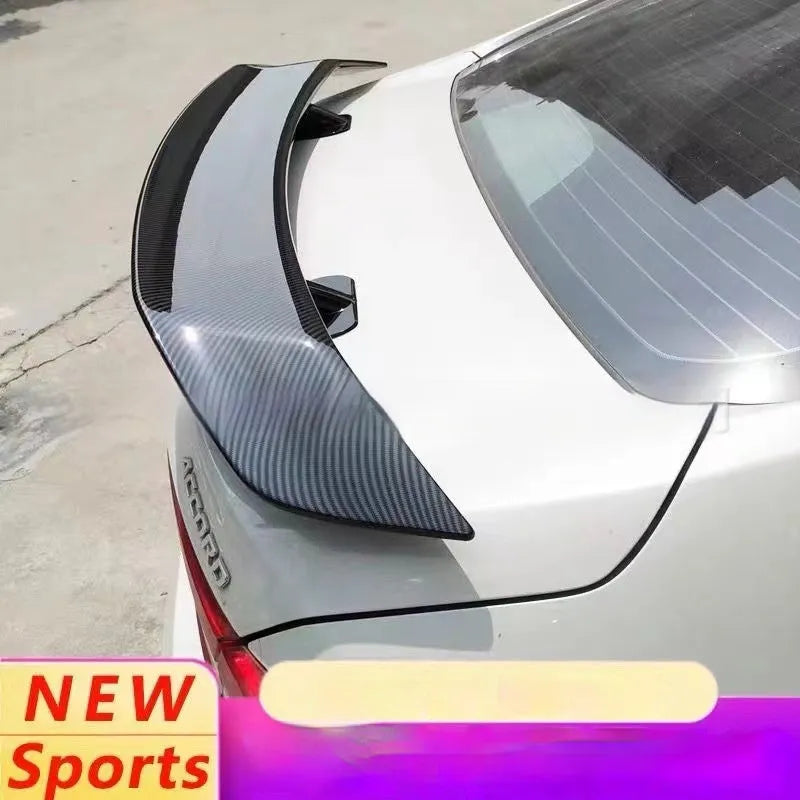 Universal fit car tail wing spoiler with punch-free mounting in carbon pattern finish.