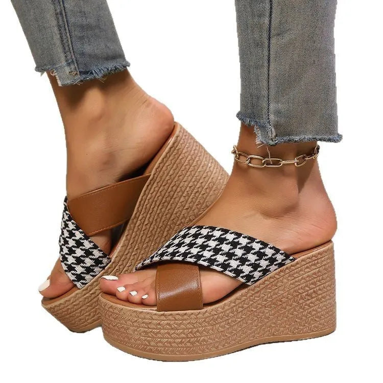 Brown and black plaid pattern casual wedge sandals with a rubber sole.