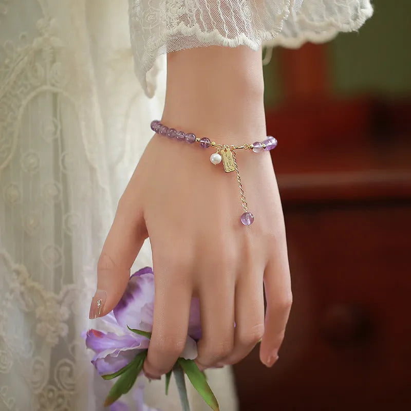 Women's natural crystal amethyst bracelet in romantic lavender colour with zodiac modelling design