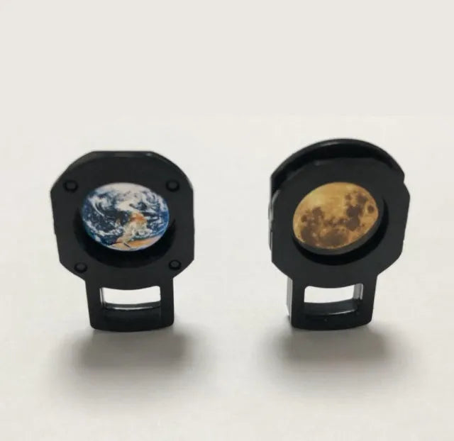 USB-powered earth and moon star projector night light with adjustable hose bracket on a bedside table.