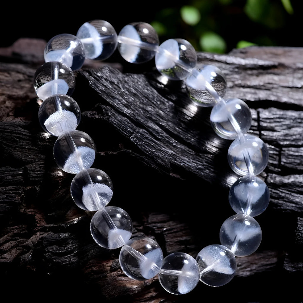 Women's natural white crystal ghost pyramid bracelet with Ruyi design on a model's wrist