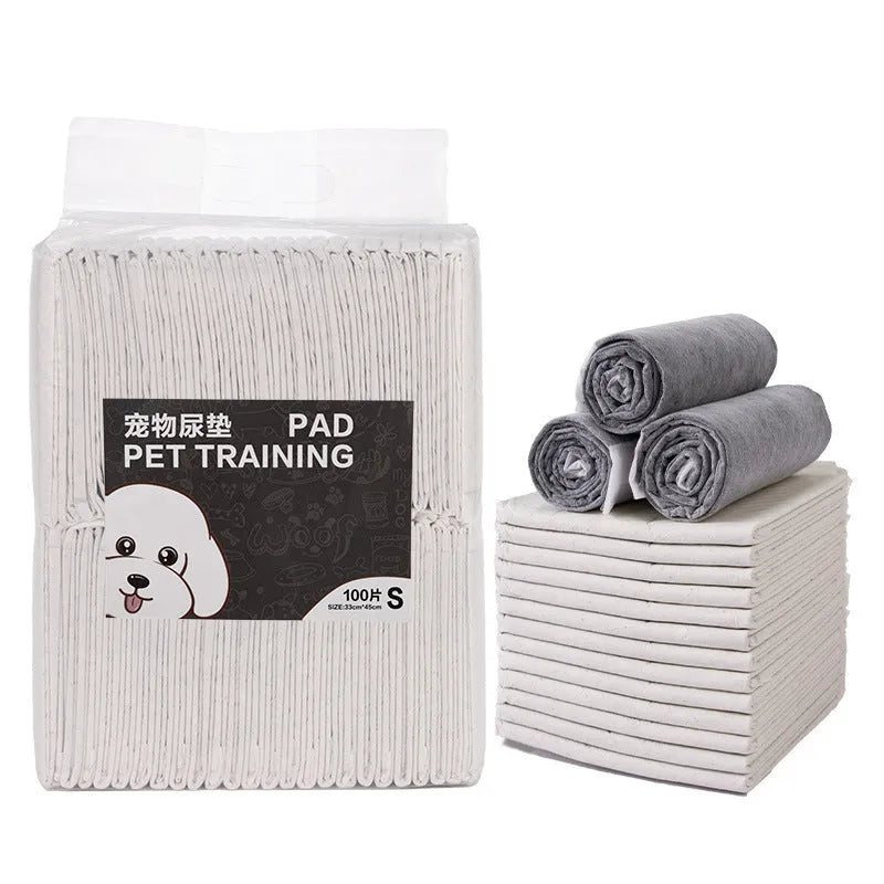 Pack of disposable absorbent pet urinal pads or diapers for dogs and cats on a floor.