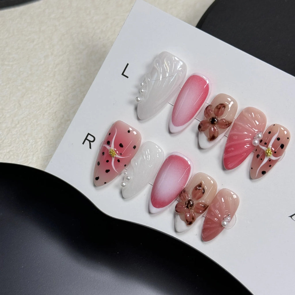 Close-up of hand-painted 3D nail patch with embossed candy pattern on an almond-shaped nail.