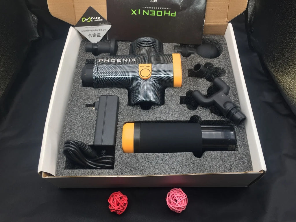 Black deep tissue fascia massage gun with four removable heads on a grey background