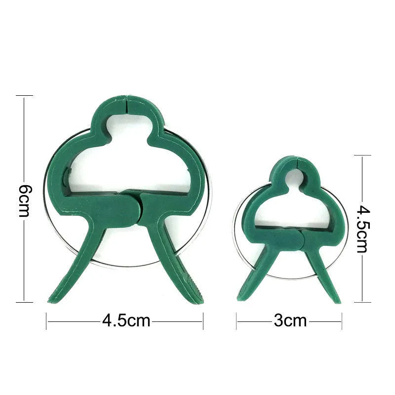 Green plastic plant fixing clips for supporting climbing vegetables and garden vines