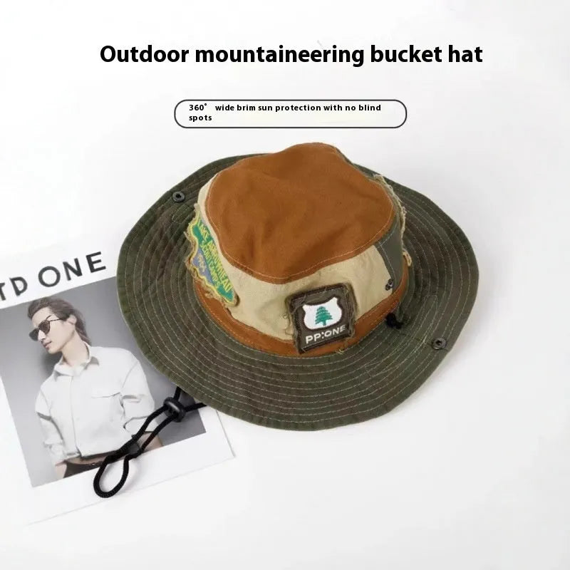 Army green women's fisherman hat with patchwork design and hand-painted details