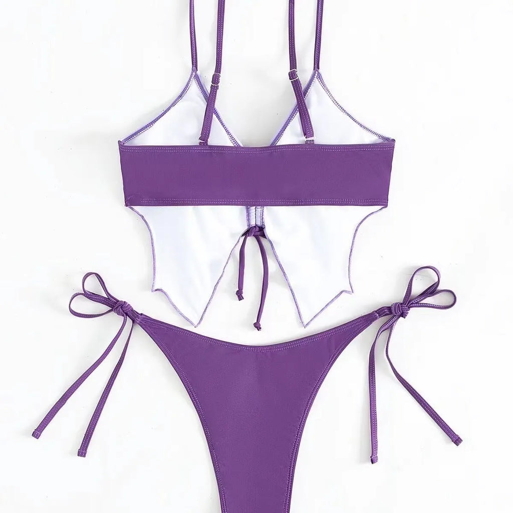 Women's purple bikini swimsuit with bow decoration on the top and split high-waisted briefs.