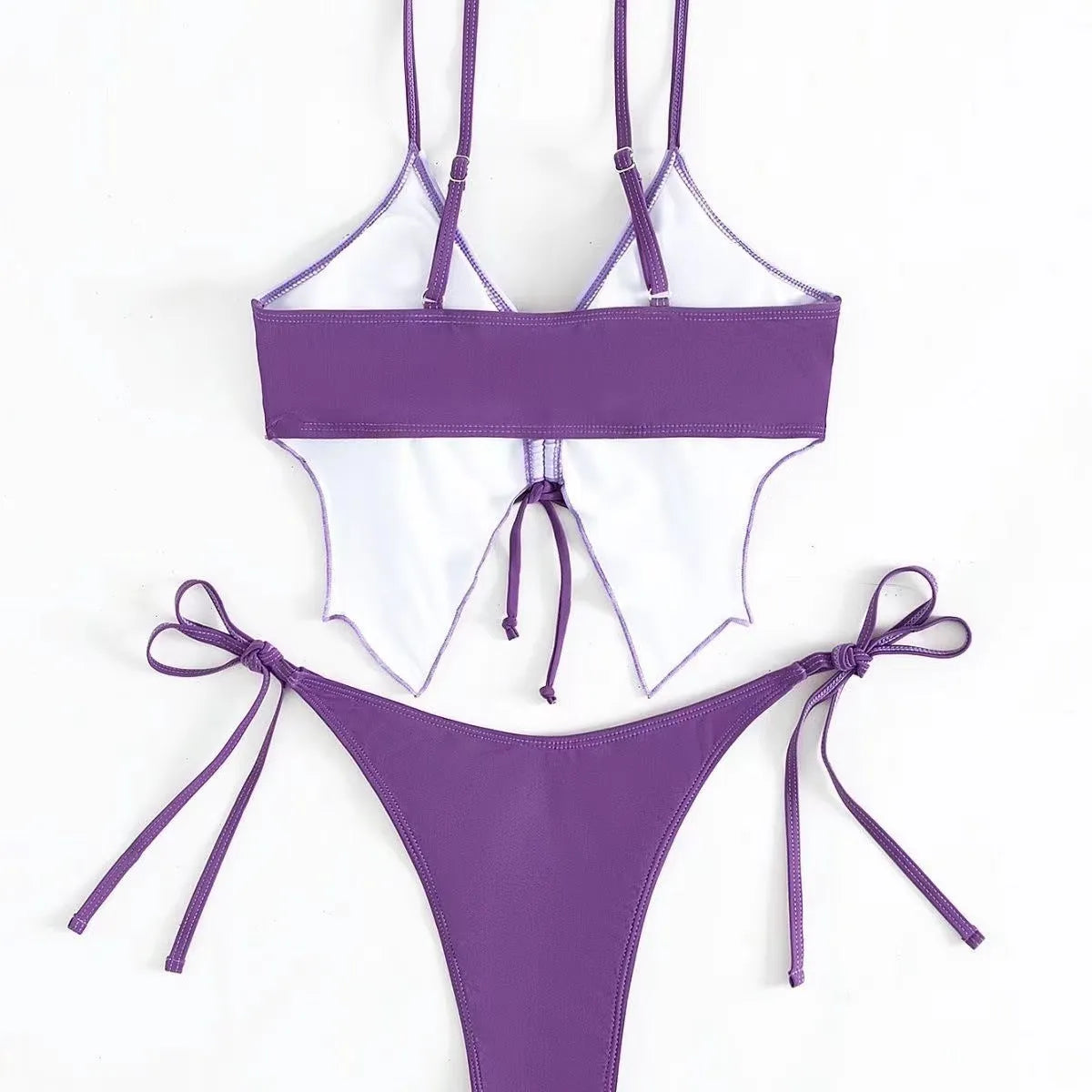 Women's purple bikini swimsuit with bow decoration on the top and split high-waisted briefs.