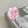 Clear resin mechanical keyboard keycap with starry sky design in green.
