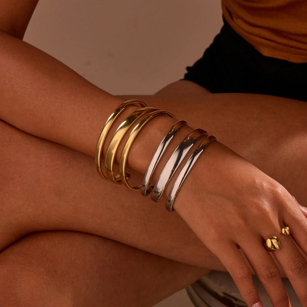 Stainless steel geometric open bracelet for women in gold or silver electroplated finish.