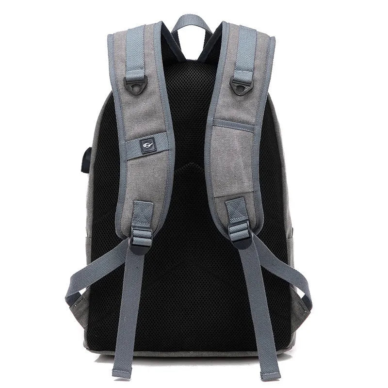 USB rechargeable canvas backpack showing computer pocket and front zipper compartment