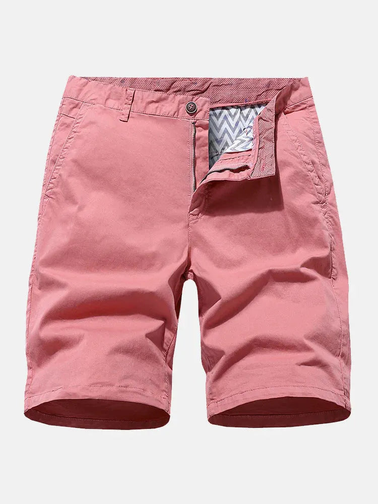 Man wearing blue denim casual shorts with an elastic waistband, showcasing the loose fit and straight leg design.