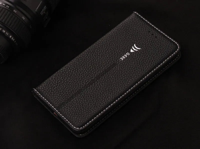 Black PU leather wallet phone case open showing card slot, next to an iPhone.