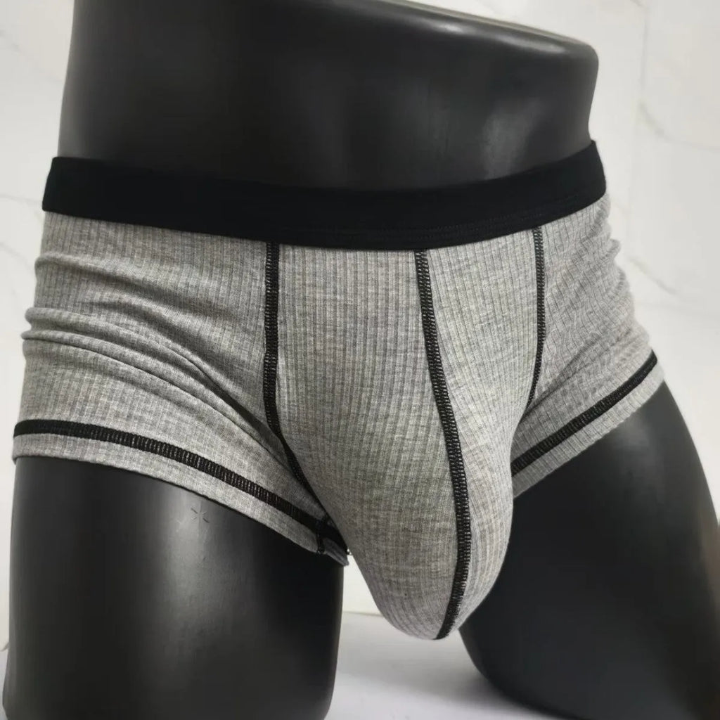 Men's solid colour boxers in Army Green shown flat, highlighting thin breathable fabric and body shaping design.