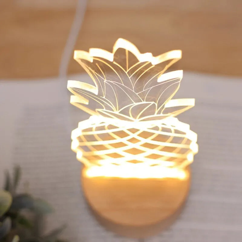Wood and acrylic pineapple-shaped cartoon night light with USB cable and dimmer switch on a table.
