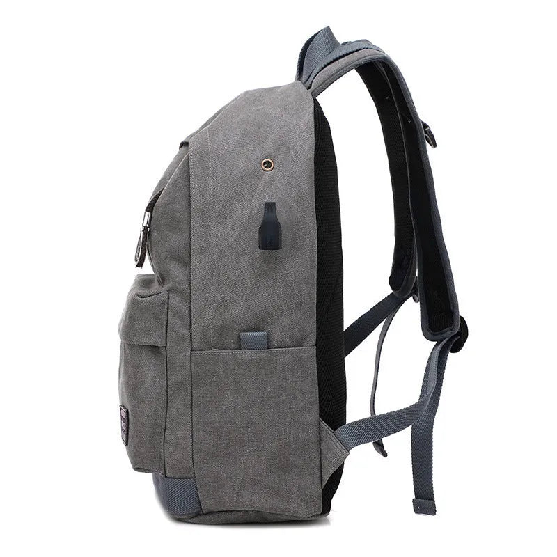 USB rechargeable canvas backpack showing computer pocket and front zipper compartment