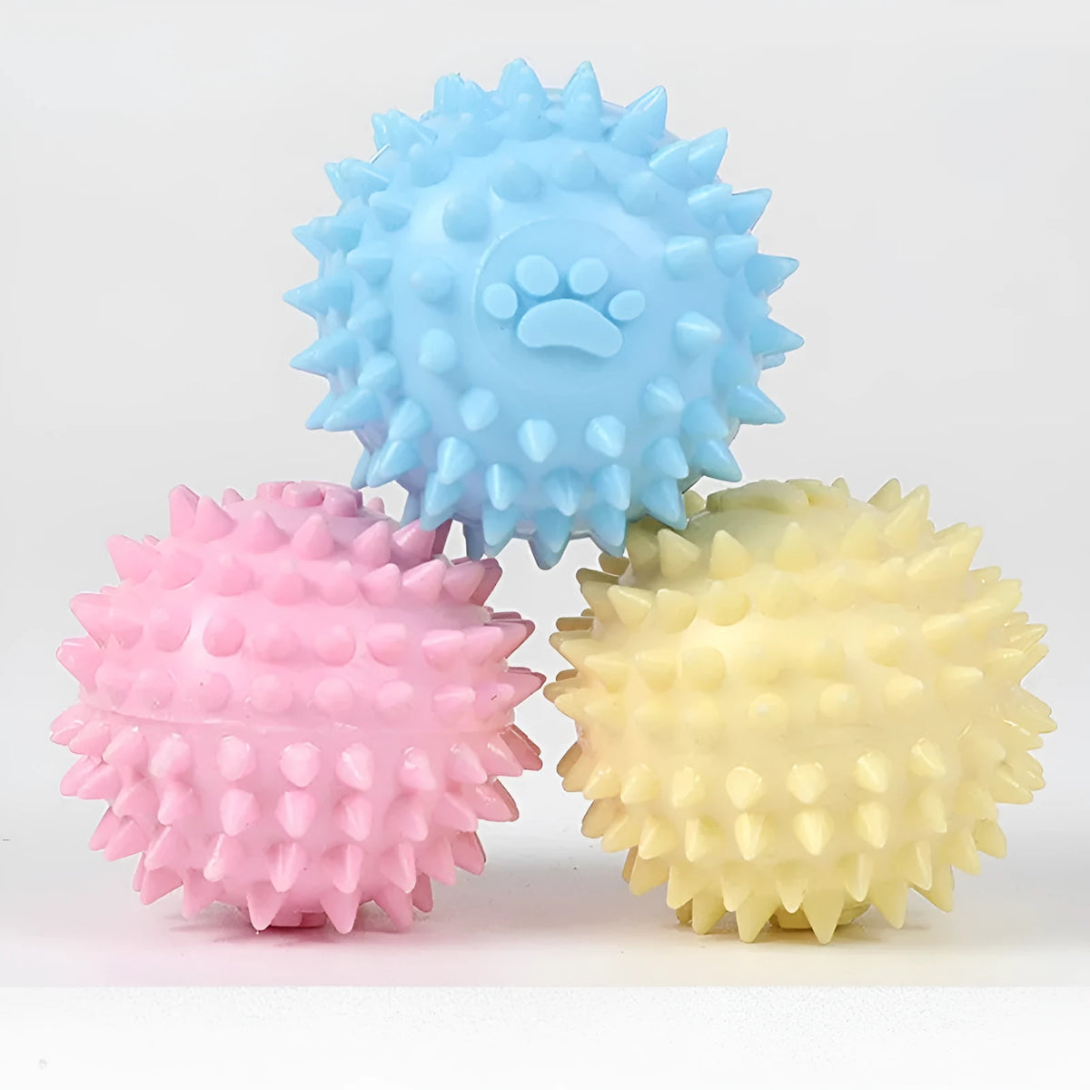 Blue dog chewing toy with textured footprint design measuring 6cm diameter