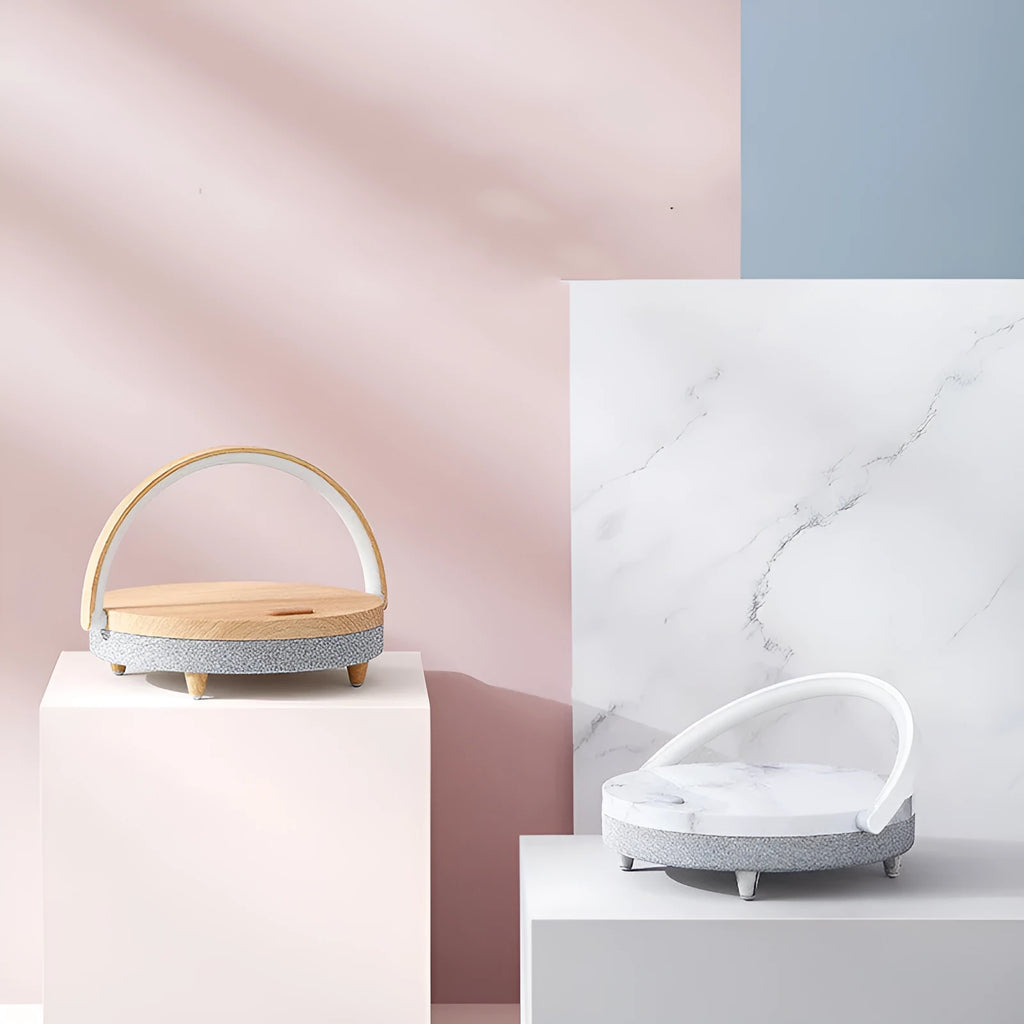 Wireless charging LED night light with Bluetooth speaker and phone holder in marble or wood grain finish