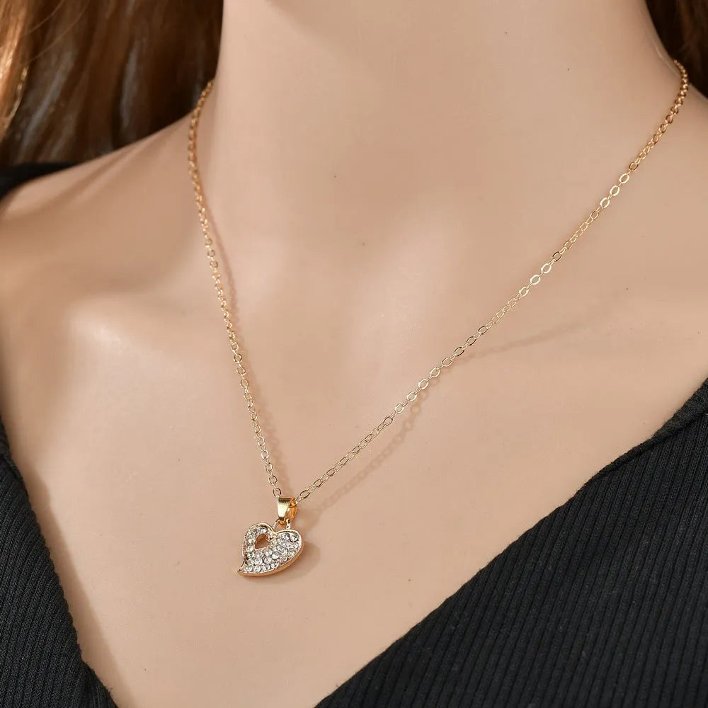 Gold electroplated alloy jewellery set with European styling featuring love, water drop and bell patterns