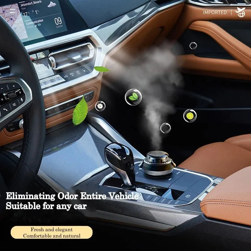 Solar powered kinetic double ring rotating car air freshener diffuser in black plastic.
