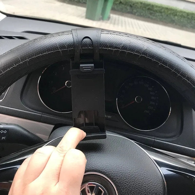 Black steering wheel phone mount with elastic clip and silicone padding for smartphones