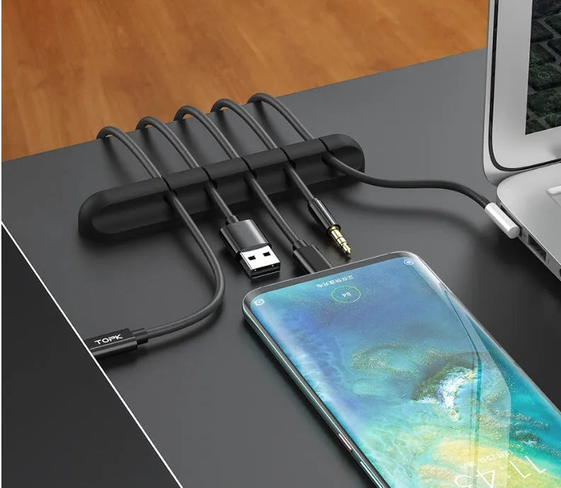 Black silicone desktop cable manager clips with strong double-sided glue for USB cables and wired headphones