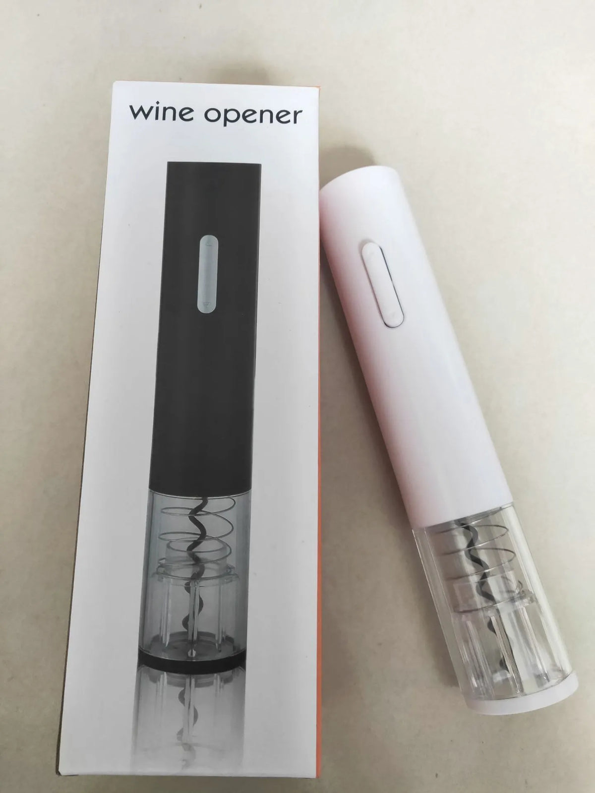 Black automatic electric wine bottle opener with foil cutter on silver wine bottle