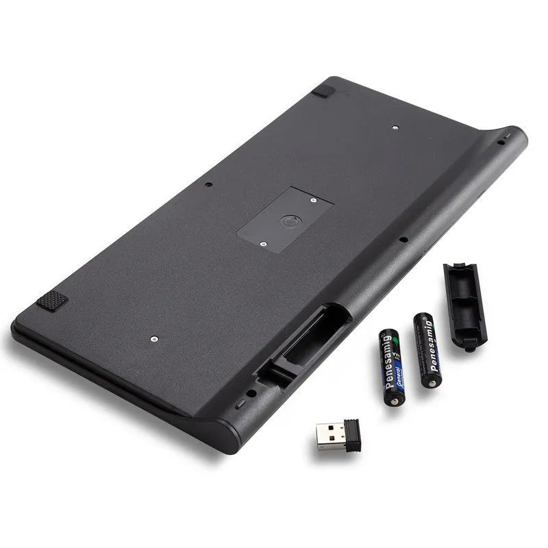 Black and white wireless keyboard and mouse set with USB receiver on desk