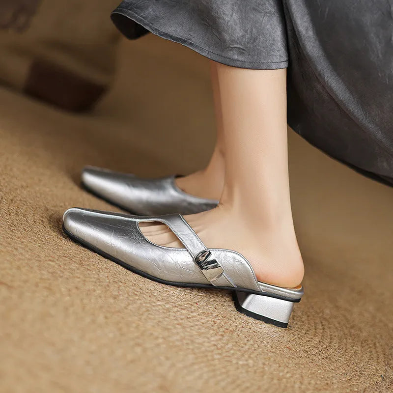 British style square toe leisure slippers in beige with a low heel and rubber sole.