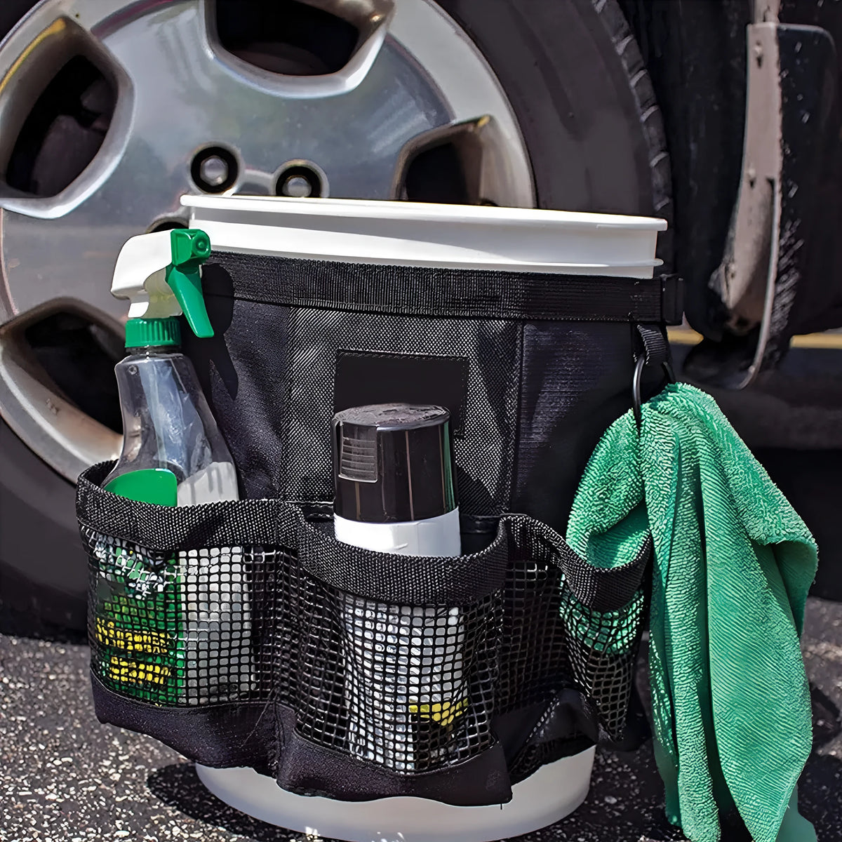 Black cylindrical polyester storage bag hanging with 5 gallon drum compatibility for car washing tools organisation