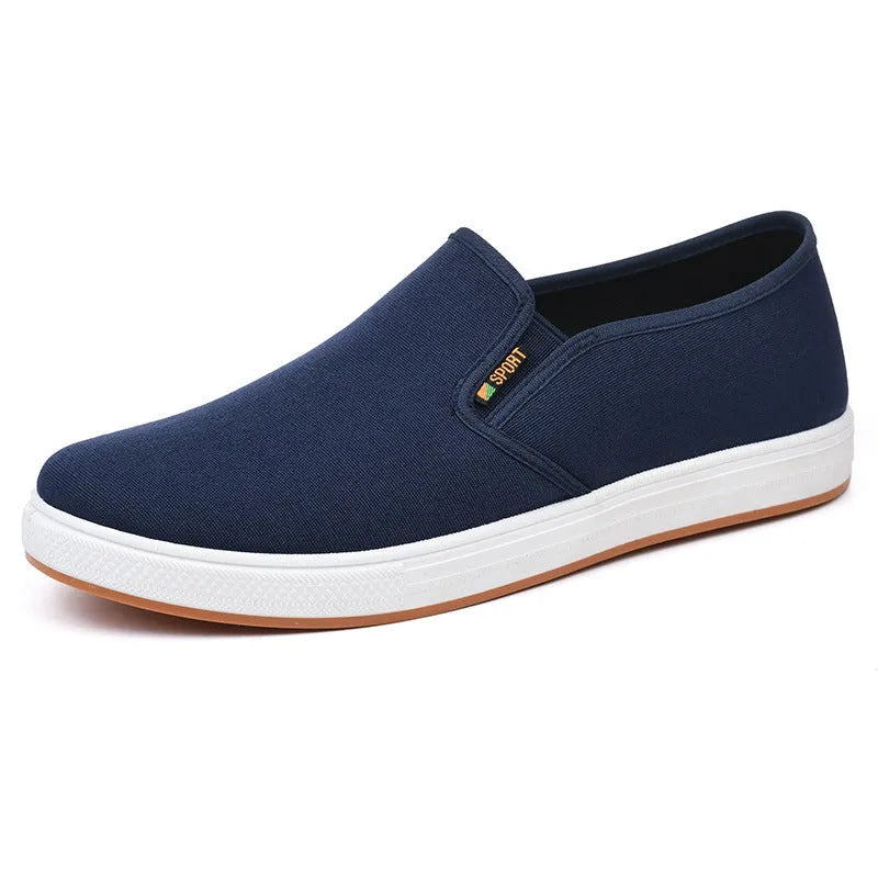 Men's black and blue low-top canvas slip-on shoes with round toe and composite soles