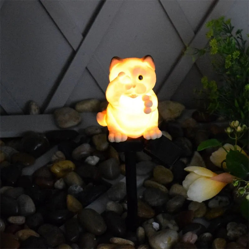 Brown cat-shaped solar lawn light for garden pathway illumination with weather-resistant resin construction