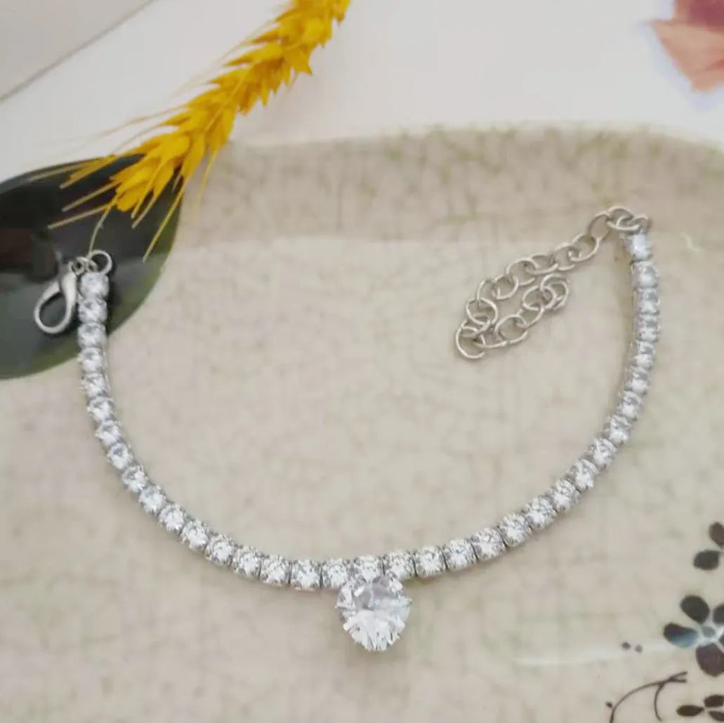 Gold heart-shaped rhinestone dog collar with bling crystals and adjustable extension chain