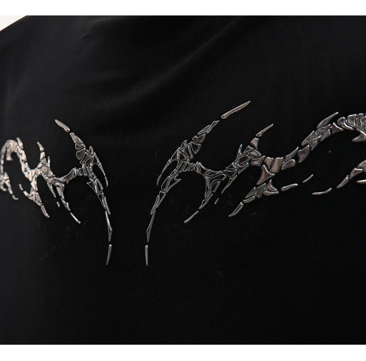 Black and white slim-fit long sleeve mesh bottoming shirt for men on a hanger.
