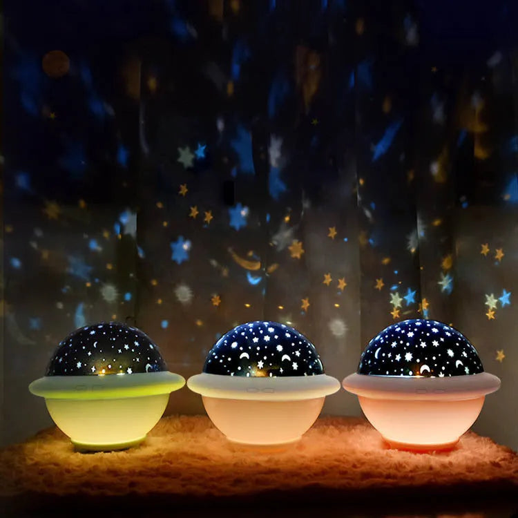 UFO-shaped plastic starry sky projection night light in pink colour with USB cable