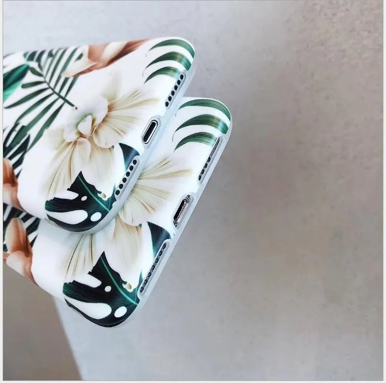 Floral banana leaf design on a flexible TPU phone case for compatible iPhone models.