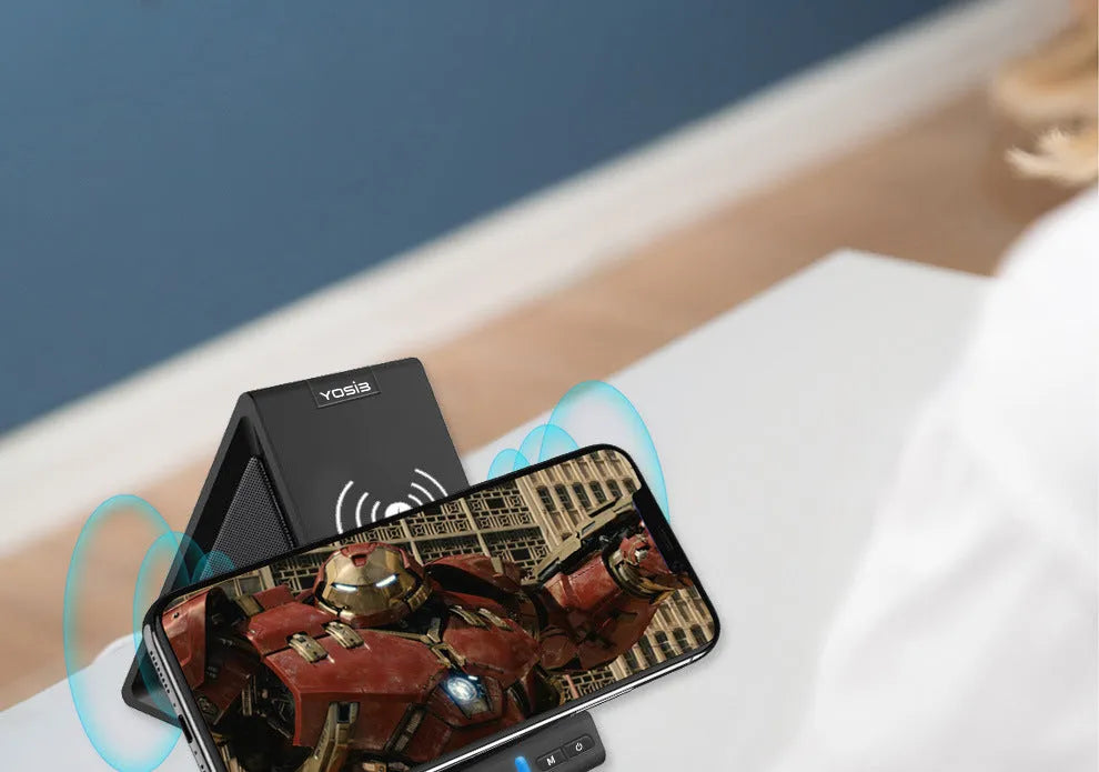 Black multifunctional mobile phone holder with built-in Bluetooth speaker and wireless charging capability