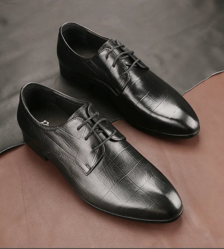 Men's black handmade cow leather derby shoes with pointed toe and checkered sewing pattern on a rubber sole.