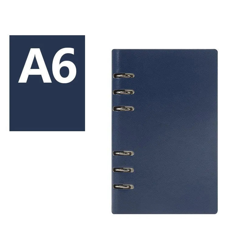 Loose-leaf business notebook in A5 size with a black imitation leather cover open to show beige paper.