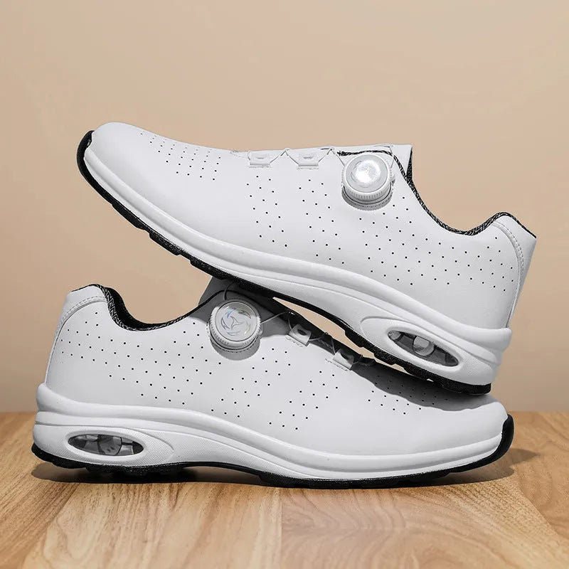 Men's black low-top casual shoes with mesh upper and white laces on a flat composite sole.