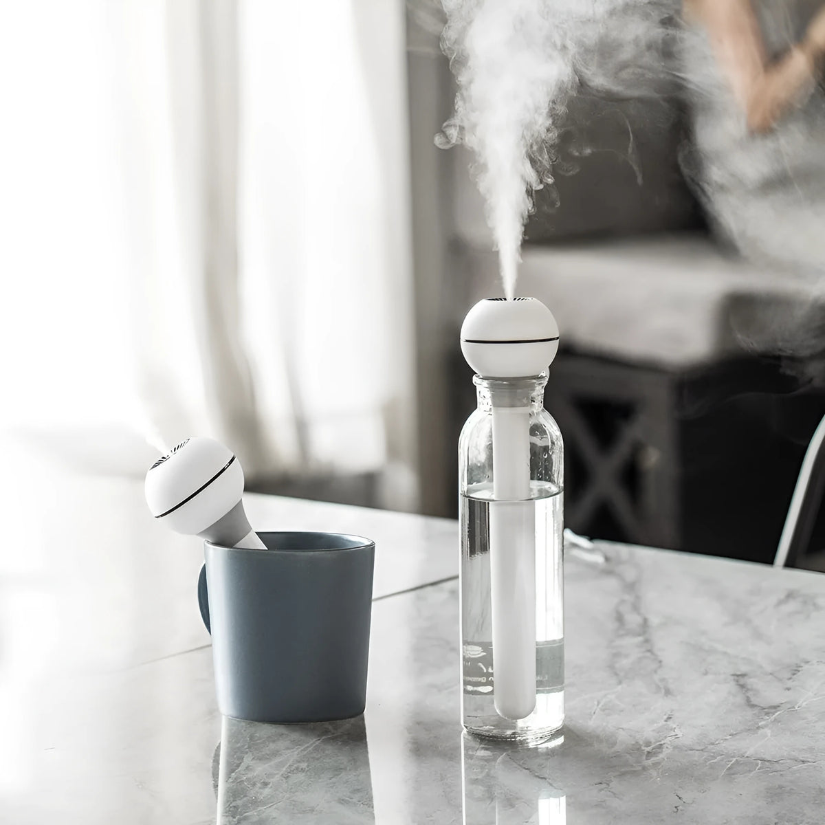 White columnar USB ultrasonic humidifier with 1-litre tank and quiet operation for small rooms