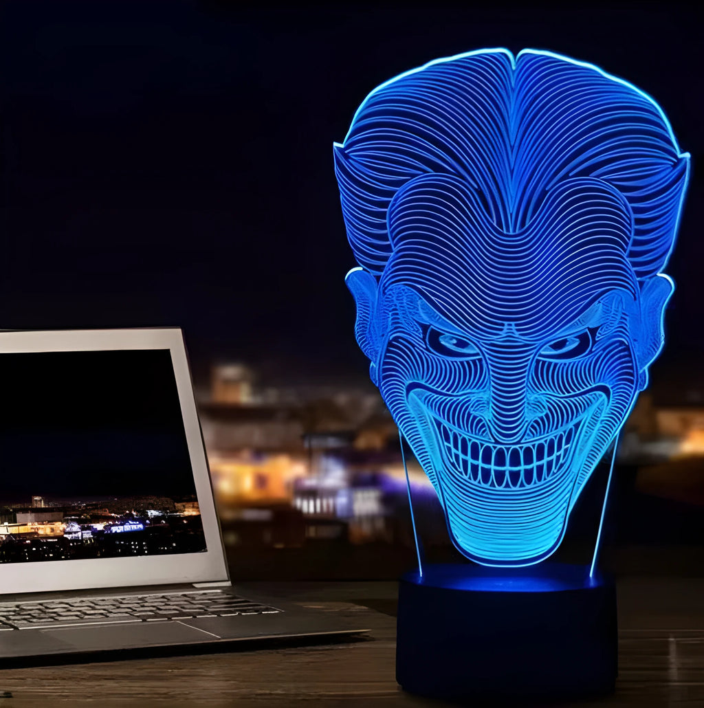 USB-powered 3D acrylic LED table lamp with remote control on a desk, displaying a gradient colour mode.