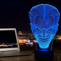 USB-powered 3D acrylic LED table lamp with remote control on a desk, displaying a gradient colour mode.