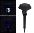 Black solar-powered insect-killing lawn lamp with white and purple LED lights for garden pest control.