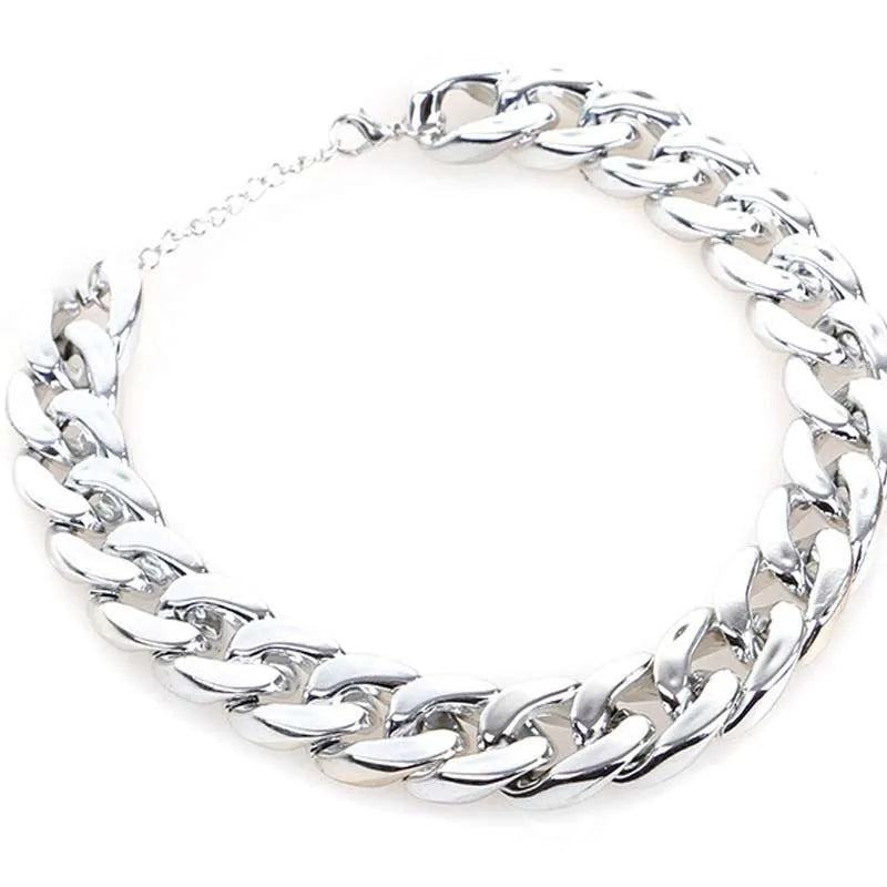 Geometric twisted chain dog collar ornament in metallic gold or white finish, shown with chain buckle.
