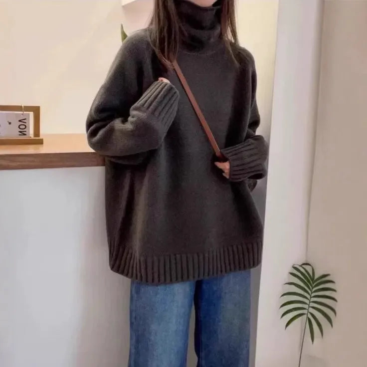 Women's loose fit thick turtleneck sweater with a 3D curling pile collar in red.