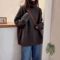Women's loose fit thick turtleneck sweater with a 3D curling pile collar in red.