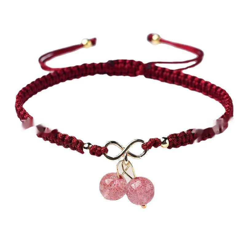 A women's bracelet with a single strand of natural strawberry quartz stones cut in a fruit shape.