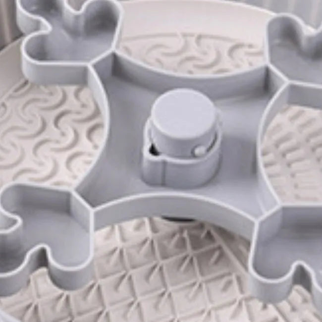 Rotating pet slow feeder bowl with a blue windmill-pattern silicone licking mat inserted.